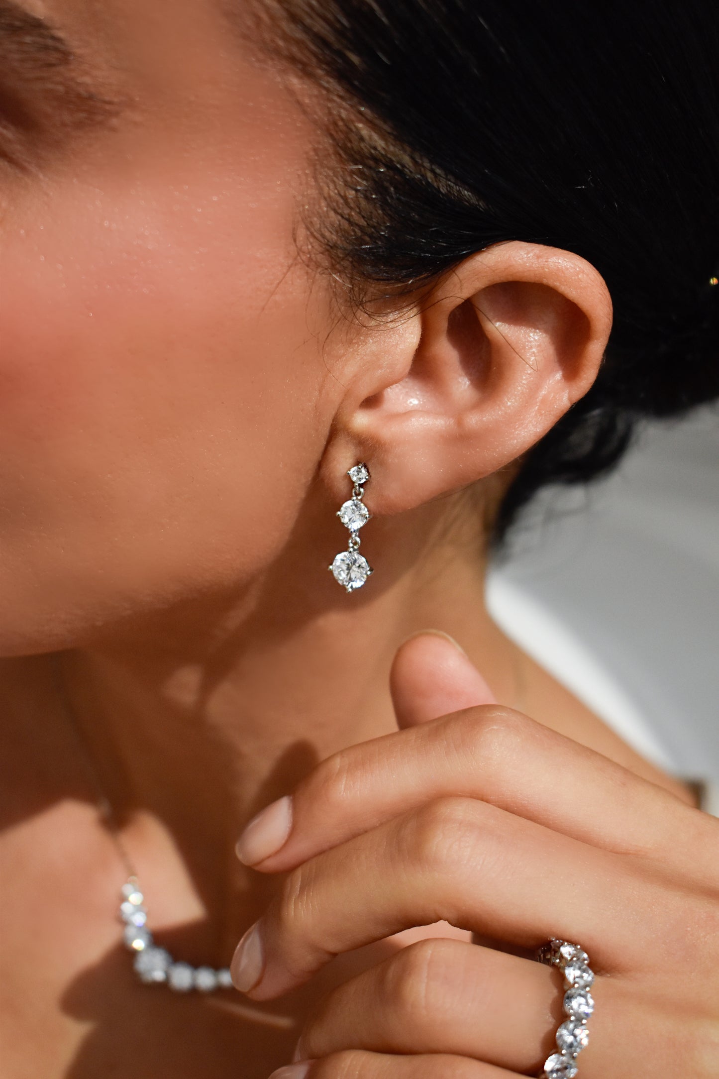 Round Cut Graduated Stone Drop Earrings