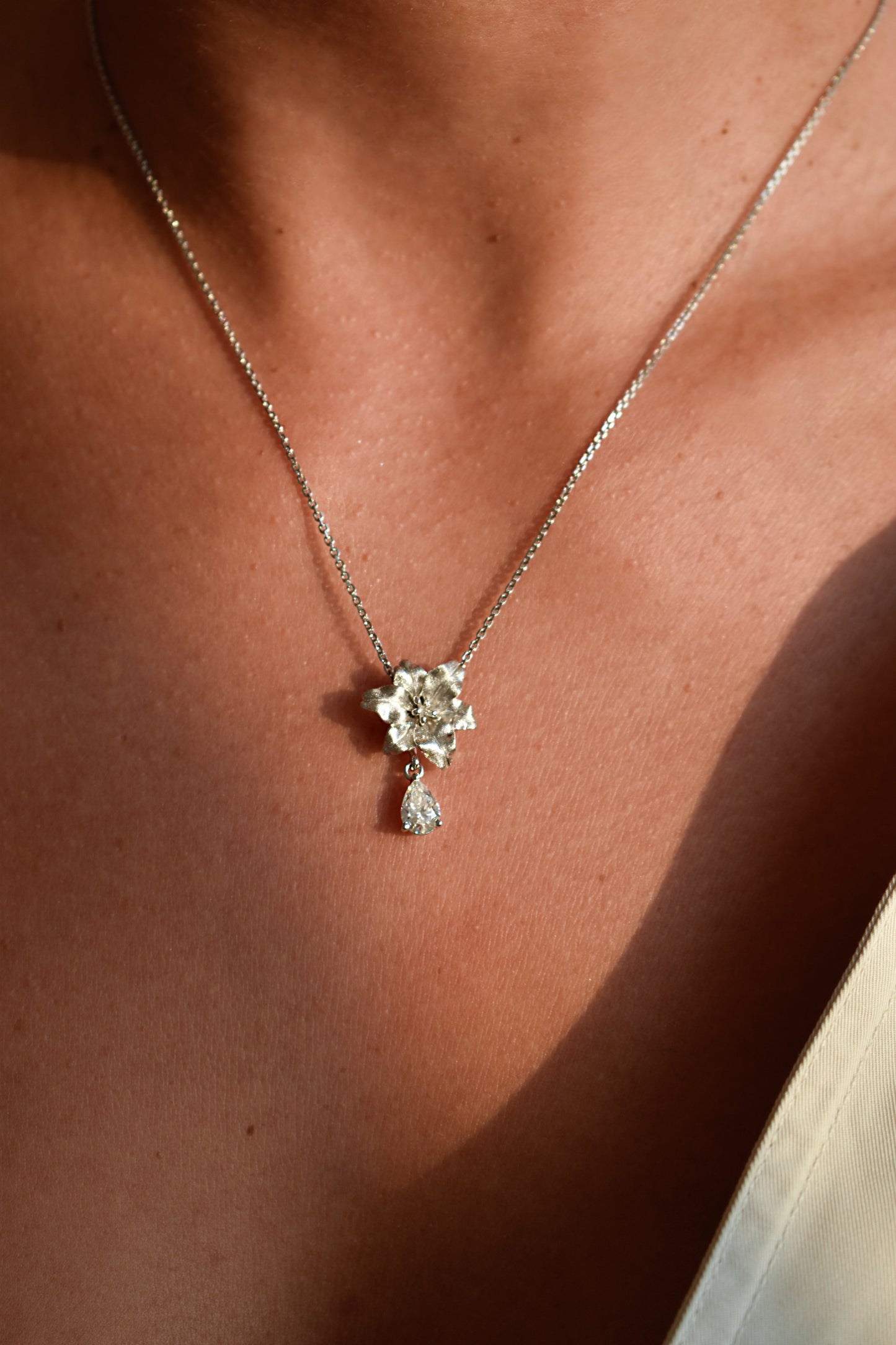 Brushed Silver Rose with Drop Moissanite Pear Shape Necklace